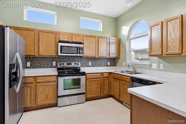 1145 York Ave, Howell, MI 48843 - kitchen featuring appliances with stainless steel finishes, light countertops, and decorative backsplash