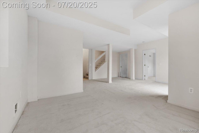 1145 York Ave, Howell, MI 48843 - carpeted empty room with stairs