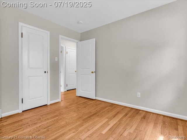 3850 Parker St, Dearborn, MI 48124 - unfurnished bedroom featuring light wood-style floors