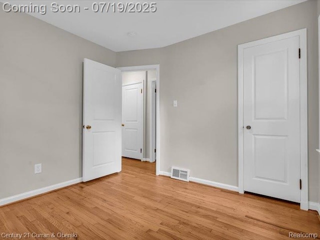 3850 Parker St, Dearborn, MI 48124 - unfurnished bedroom featuring baseboards and light wood finished floors
