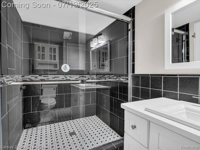 3850 Parker St, Dearborn, MI 48124 - bathroom featuring vanity, tile walls, and a stall shower