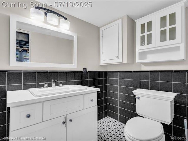 3850 Parker St, Dearborn, MI 48124 - half bath with tile walls, vanity, and a wainscoted wall