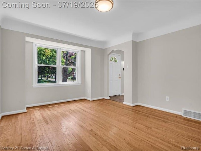 3850 Parker St, Dearborn, MI 48124 - unfurnished room with arched walkways and wood finished floors