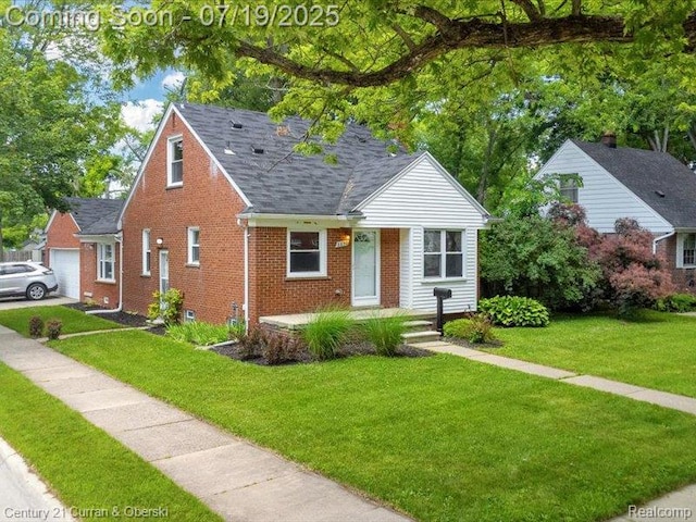 3850 Parker St, Dearborn, MI 48124 - bungalow-style house featuring brick siding, a front yard, a shingled roof, and covered porch