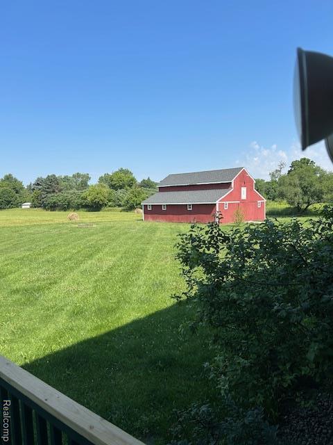 20100 Hickory Ridge Rd, Holly, MI 48442 - view of grassy yard with a barn and an outdoor structure