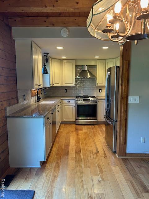 20100 Hickory Ridge Rd, Holly, MI 48442 - kitchen featuring stainless steel appliances, wall chimney exhaust hood, light wood-style floors, tasteful backsplash, and a wood ceiling with exposed beams