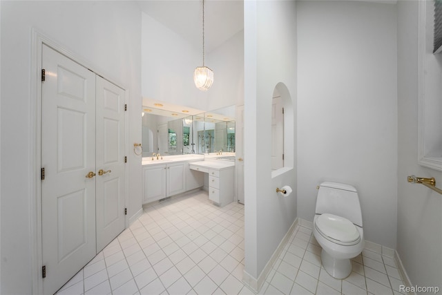 8931 Bridge Rd, Grosse Ile, MI 48138 - full bath with vanity, tile patterned flooring, high vaulted ceiling, and a chandelier