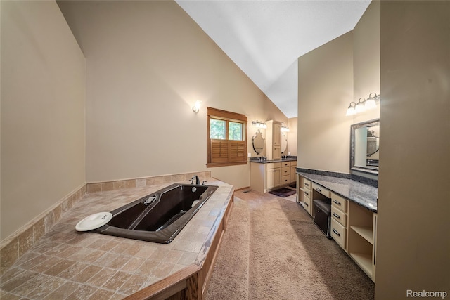 8931 Bridge Rd, Grosse Ile, MI 48138 - full bath featuring vanity, a bath, and high vaulted ceiling