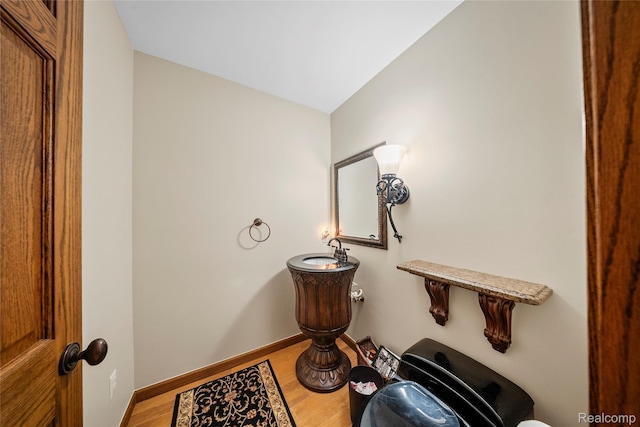 8931 Bridge Rd, Grosse Ile, MI 48138 - half bath featuring wood finished floors and baseboards