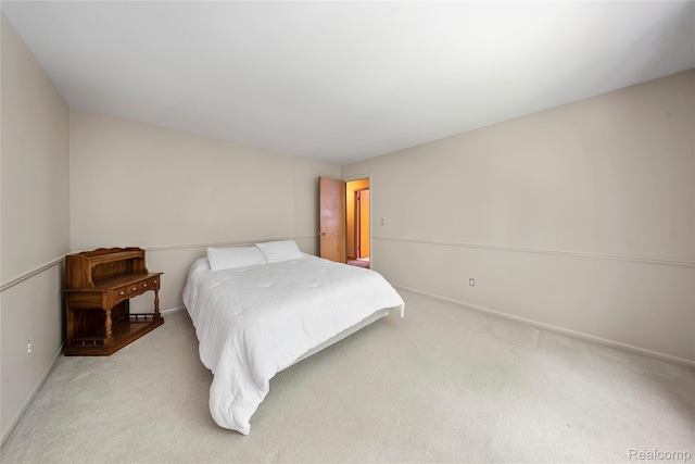 8931 Bridge Rd, Grosse Ile, MI 48138 - bedroom featuring light carpet and baseboards