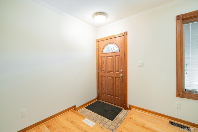 21819 Meridian Rd, Grosse Ile, MI 48138 - entryway featuring crown molding and wood finished floors