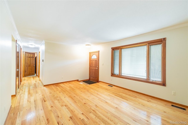 21819 Meridian Rd, Grosse Ile, MI 48138 - empty room featuring ornamental molding and light wood-style floors