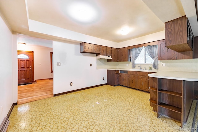 21819 Meridian Rd, Grosse Ile, MI 48138 - kitchen with open shelves, light countertops, and under cabinet range hood