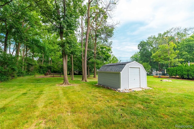 21819 Meridian Rd, Grosse Ile, MI 48138 - view of green lawn with a storage shed and view of scattered trees