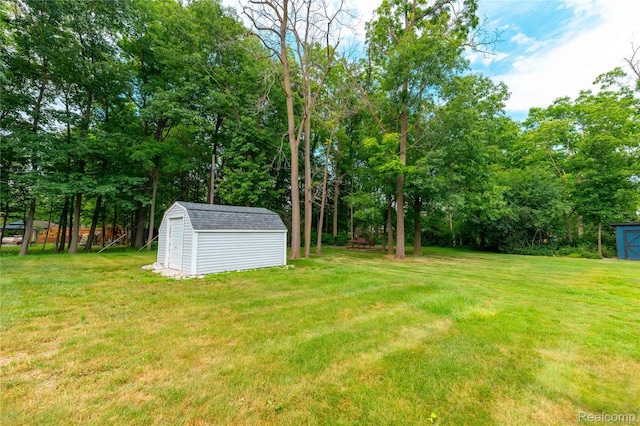 21819 Meridian Rd, Grosse Ile, MI 48138 - view of grassy yard featuring a storage shed