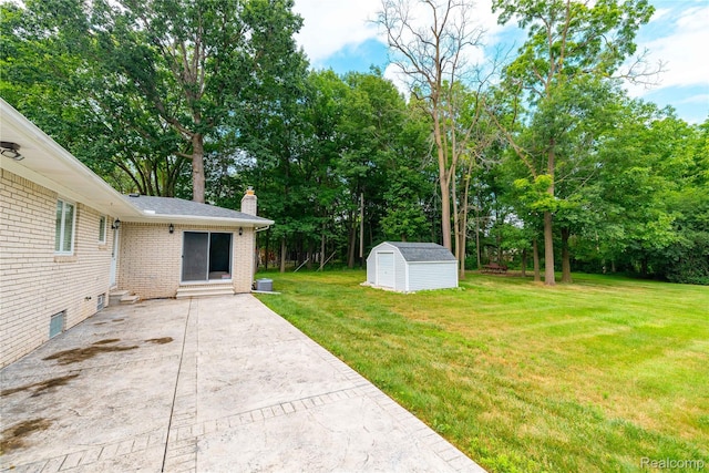 21819 Meridian Rd, Grosse Ile, MI 48138 - view of grassy yard featuring a patio, a shed, and view of wooded area