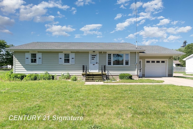306 Macomber Ave, Auburn, MI 48611 - view of front of property featuring a garage, a front yard, and driveway