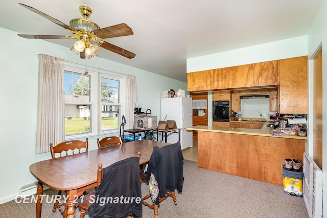 306 Macomber Ave, Auburn, MI 48611 - carpeted dining area with ceiling fan