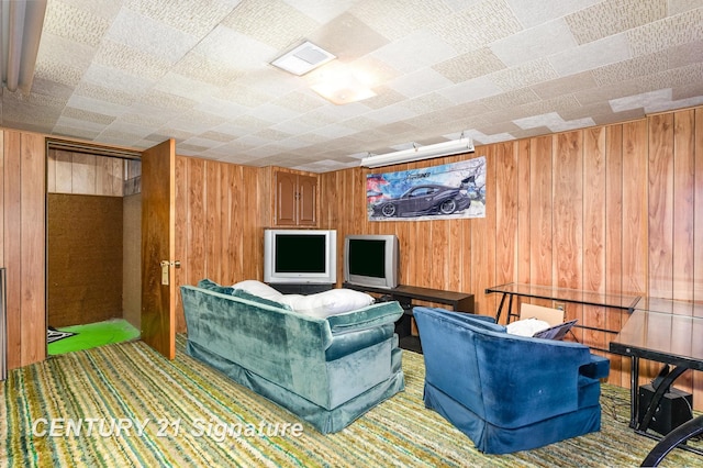 306 Macomber Ave, Auburn, MI 48611 - carpeted living room with wooden walls
