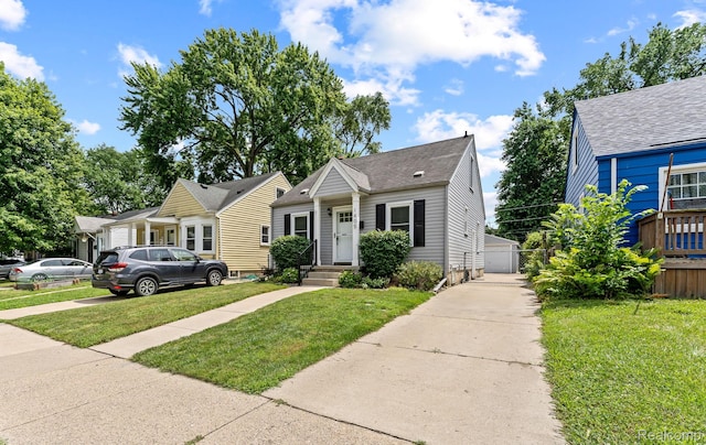 1405 Fielding St, Ferndale, MI 48220 - view of front of house with a shingled roof, a gate, and a garage