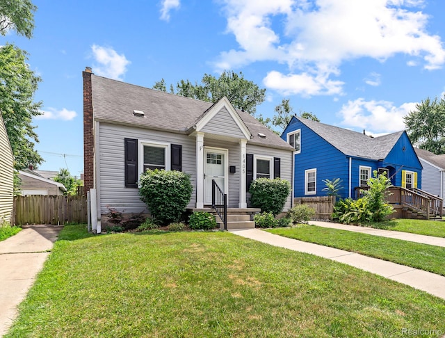 1405 Fielding St, Ferndale, MI 48220 - bungalow-style house featuring a shingled roof and a chimney