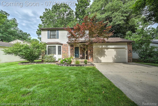 978 Oak Ridge Cir, Brighton, MI 48116 - traditional-style house with brick siding, a garage, concrete driveway, and a front lawn