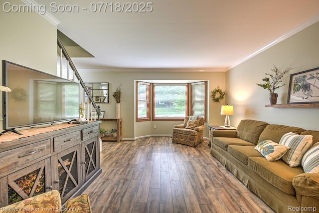 978 Oak Ridge Cir, Brighton, MI 48116 - living area featuring dark wood finished floors, ornamental molding, and stairway