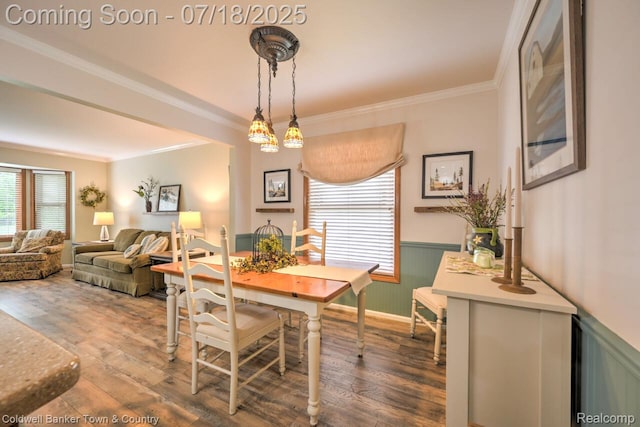 978 Oak Ridge Cir, Brighton, MI 48116 - dining area featuring healthy amount of natural light, wainscoting, wood finished floors, and crown molding