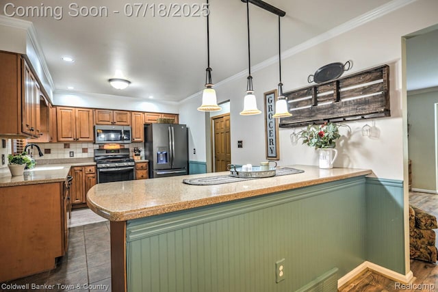 978 Oak Ridge Cir, Brighton, MI 48116 - kitchen with appliances with stainless steel finishes, a peninsula, ornamental molding, decorative backsplash, and brown cabinets