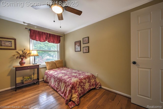 978 Oak Ridge Cir, Brighton, MI 48116 - bedroom featuring ornamental molding, hardwood / wood-style flooring, and ceiling fan