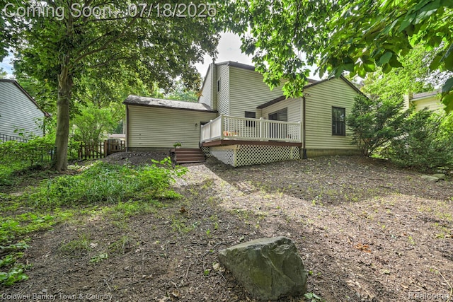 978 Oak Ridge Cir, Brighton, MI 48116 - back of house featuring a deck
