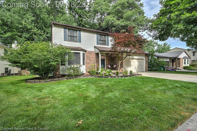 978 Oak Ridge Cir, Brighton, MI 48116 - traditional home with brick siding, driveway, and a front lawn