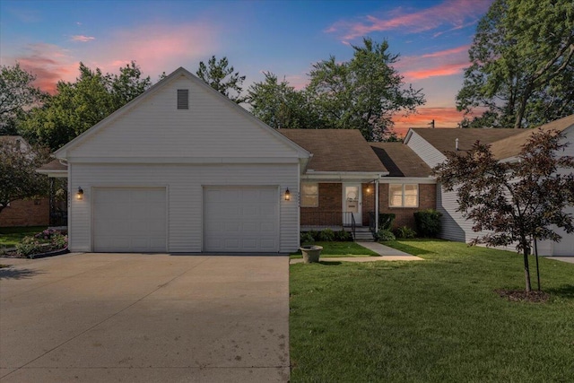 22830 Lincoln Ct, Saint Clair Shores, MI 48082 - view of front of property with concrete driveway, a garage, and a yard