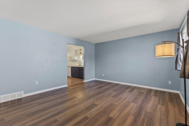 22830 Lincoln Ct, Saint Clair Shores, MI 48082 - unfurnished room featuring dark wood-style flooring and baseboards