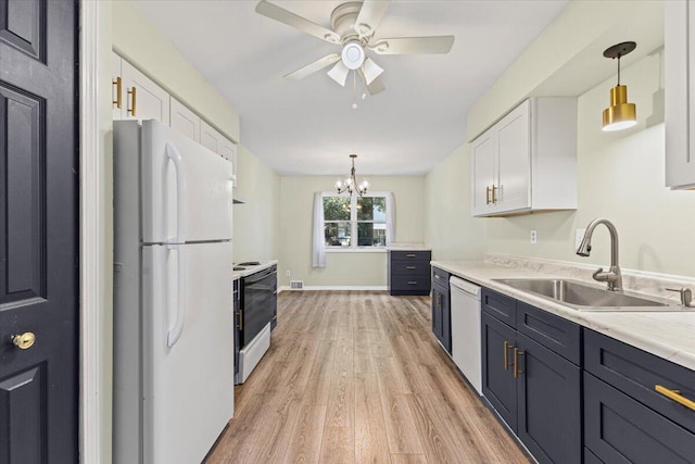 22830 Lincoln Ct, Saint Clair Shores, MI 48082 - kitchen featuring white appliances, white cabinets, light wood-style floors, light countertops, and a ceiling fan