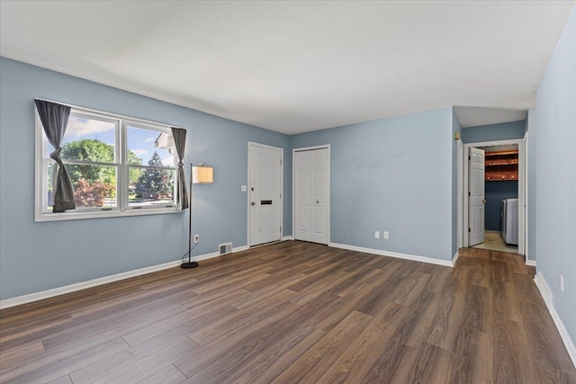22830 Lincoln Ct, Saint Clair Shores, MI 48082 - unfurnished bedroom with wood finished floors and washer / dryer
