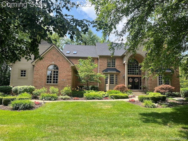 20927 Hunters Rdg, Northville, MI 48167 - view of front of home featuring a front lawn and brick siding