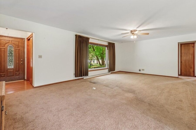 13613 Log Cabin Rd, Three Oaks, MI 49128 - unfurnished living room with light carpet and a ceiling fan
