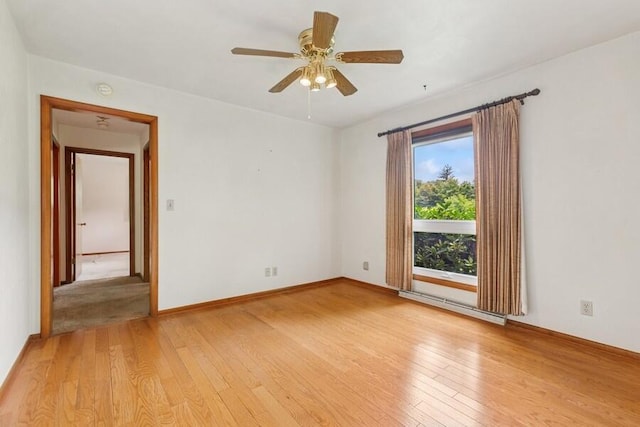 13613 Log Cabin Rd, Three Oaks, MI 49128 - unfurnished room featuring light wood-style floors, baseboard heating, and ceiling fan