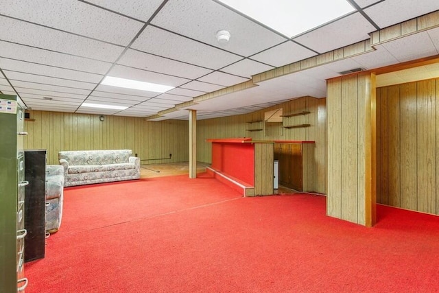 13613 Log Cabin Rd, Three Oaks, MI 49128 - finished basement featuring a bar, carpet floors, wooden walls, and a paneled ceiling