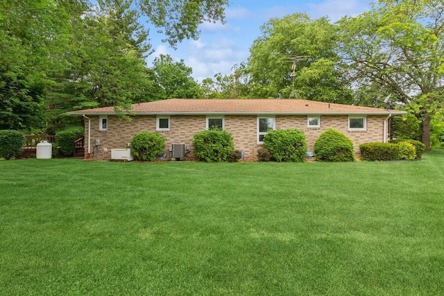13613 Log Cabin Rd, Three Oaks, MI 49128 - view of front of house featuring a front yard and brick siding