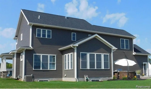7345 Verona Dr, West Bloomfield, MI 48322 - back of property featuring a yard and a hot tub