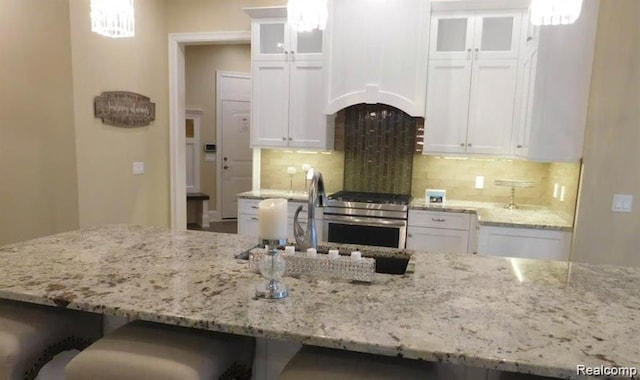 7345 Verona Dr, West Bloomfield, MI 48322 - kitchen featuring stainless steel gas stove and white cabinetry