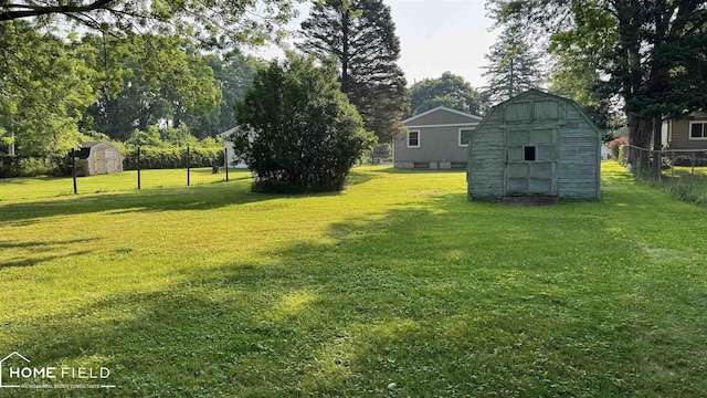 510 Martin St, Owosso, MI 48867 - view of yard featuring a storage shed and view of scattered trees