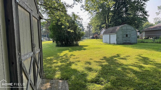 510 Martin St, Owosso, MI 48867 - view of green lawn with a storage unit