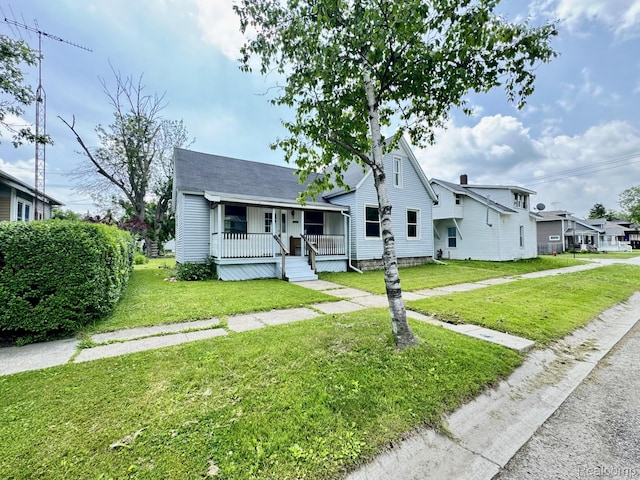 1128 White St, Port Huron, MI 48060 - bungalow-style home with a porch and a front lawn