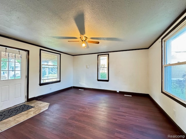 1128 White St, Port Huron, MI 48060 - foyer with dark wood-type flooring, ornamental molding, ceiling fan, and a textured ceiling