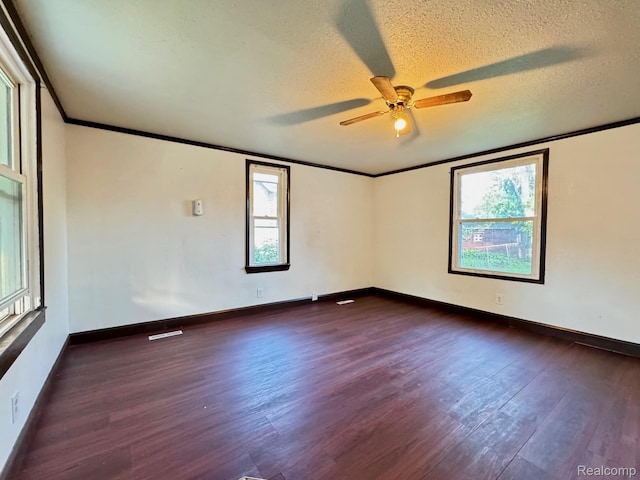 1128 White St, Port Huron, MI 48060 - unfurnished room with dark wood finished floors, ceiling fan, healthy amount of natural light, crown molding, and a textured ceiling