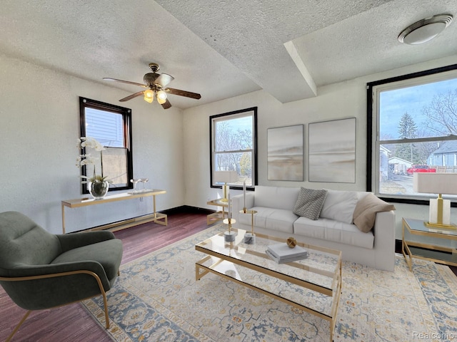 1128 White St, Port Huron, MI 48060 - living room featuring wood finished floors, a textured ceiling, and ceiling fan