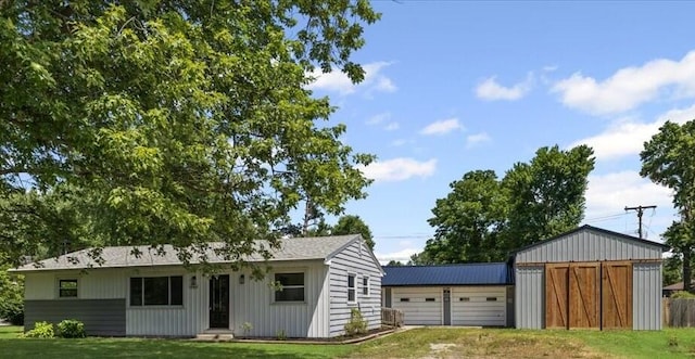 10965 Bunton Rd, Willis, MI 48191 - view of front of property with an outdoor structure, a garage, and a front yard